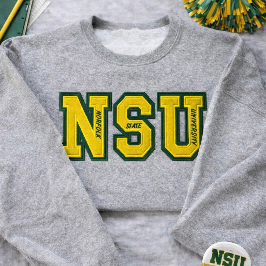 Customizable varsity style sweatshirt with double appliqué NSU lettering in green and yellow on gray background.