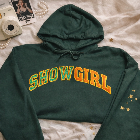 Hoodie SHOWGIRL with embroidered text on a cozy green fabric, perfect for casual wear and statement fashion.