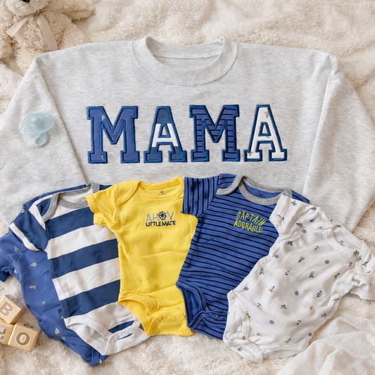 Crewneck embroidered set featuring a gray MAMA sweatshirt and matching baby onesies in yellow and blue.